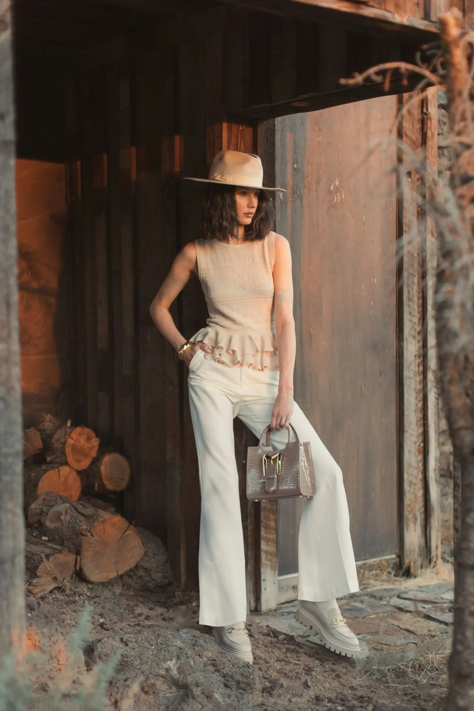 Beige Sleeveless High Neck Knit Top With Ruffle Hem